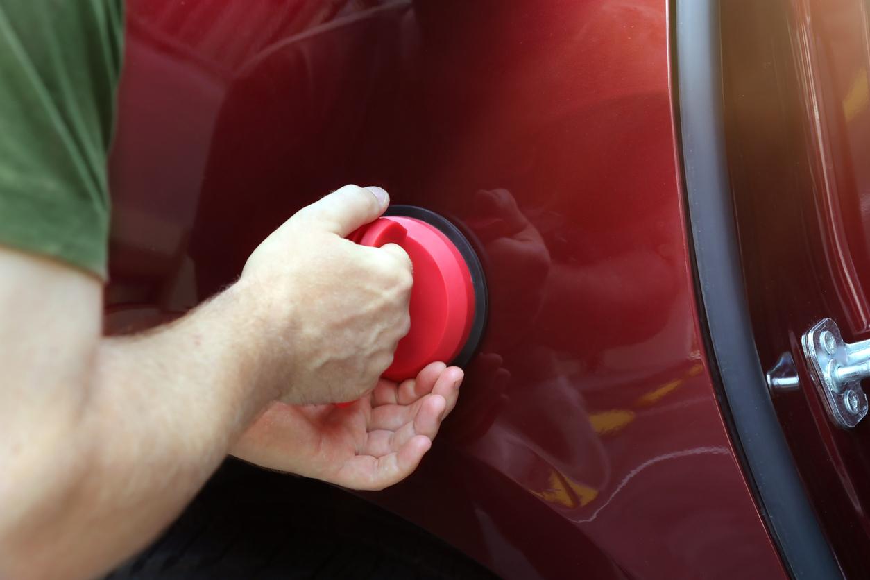 Car dent being fixed