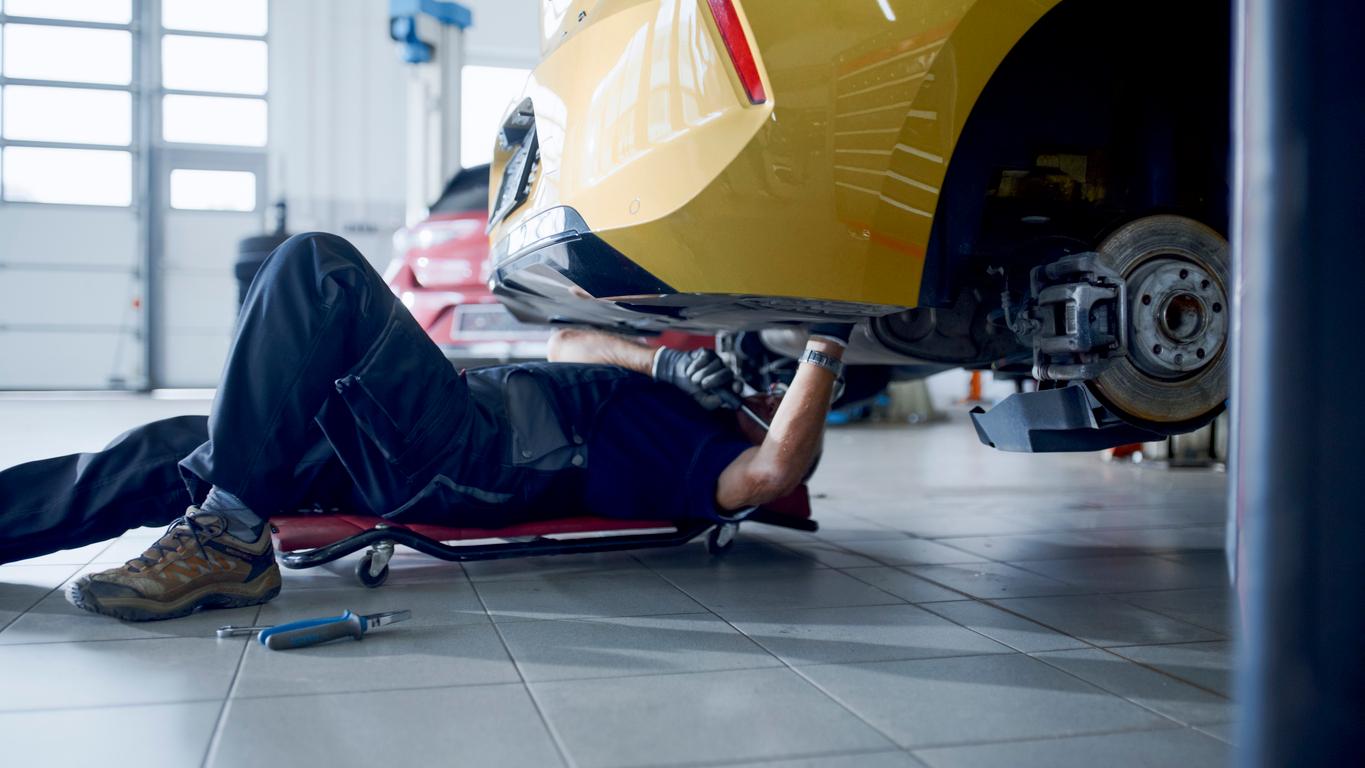 Mechanic repairing car